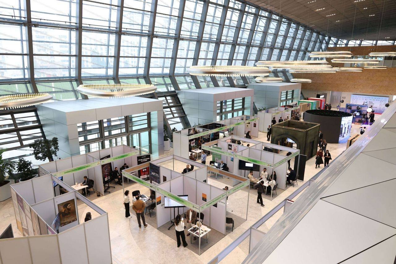 Company booths in an exhibition hall at a business trade fair