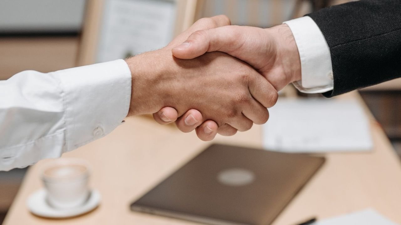 Business partners shaking hands after agreeing an import contract