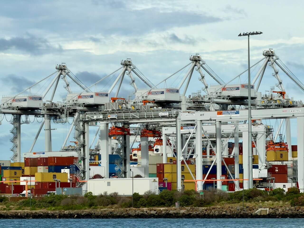 Container cranes loading cargo at an international shipping port