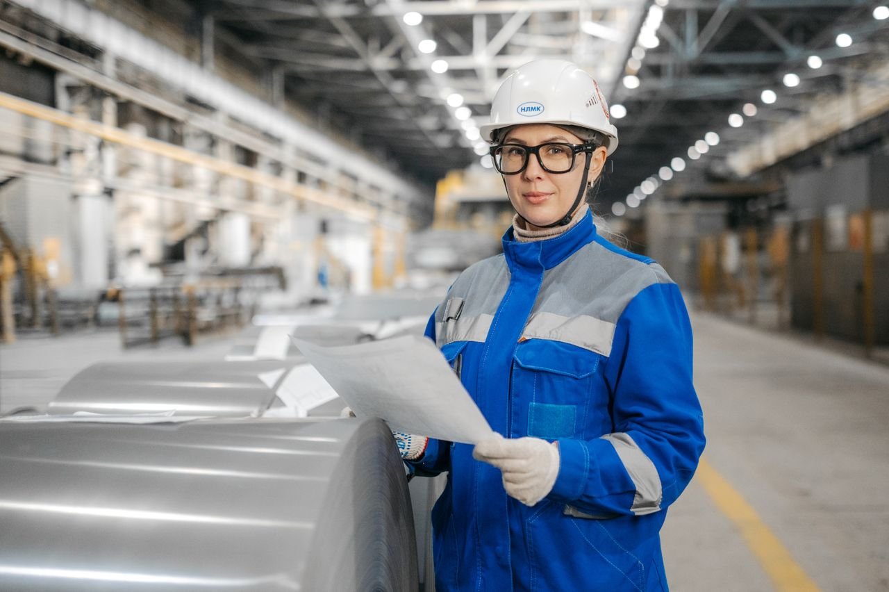 Quality inspector checking a production report in a supplier factory